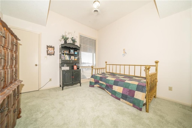 carpeted bedroom with vaulted ceiling