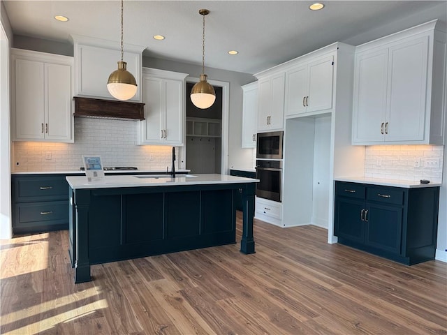 kitchen with white cabinetry and stainless steel appliances