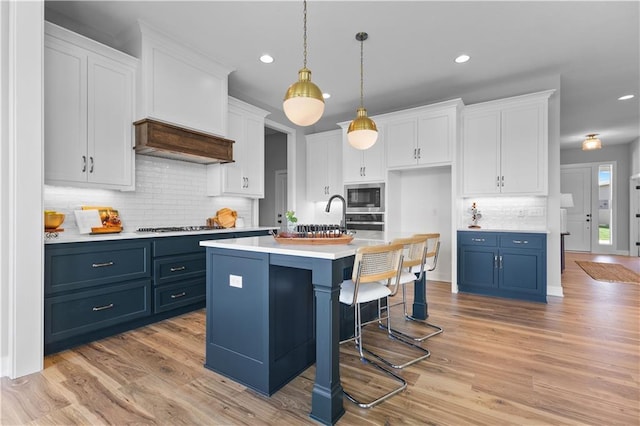 1515 SW Arbor Park Dr, Lees Summit, MO 64082 - kitchen with appliances with stainless steel finishes, backsplash, light countertops, white cabinets, and recessed lighting