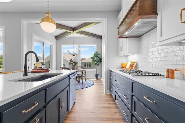 1515 SW Arbor Park Dr, Lees Summit, MO 64082 - kitchen with a sink, stainless steel appliances, premium range hood, and light countertops