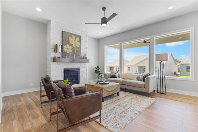 1515 SW Arbor Park Dr, Lees Summit, MO 64082 - living room featuring ceiling fan, a fireplace, baseboards, wood finished floors, and recessed lighting