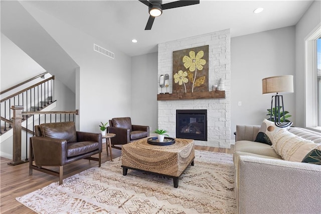 1515 SW Arbor Park Dr, Lees Summit, MO 64082 - living room with wood finished floors, ceiling fan, a fireplace, and recessed lighting