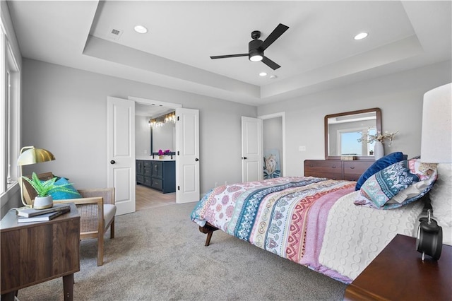 1515 SW Arbor Park Dr, Lees Summit, MO 64082 - carpeted bedroom featuring a tray ceiling, recessed lighting, connected bathroom, and ceiling fan