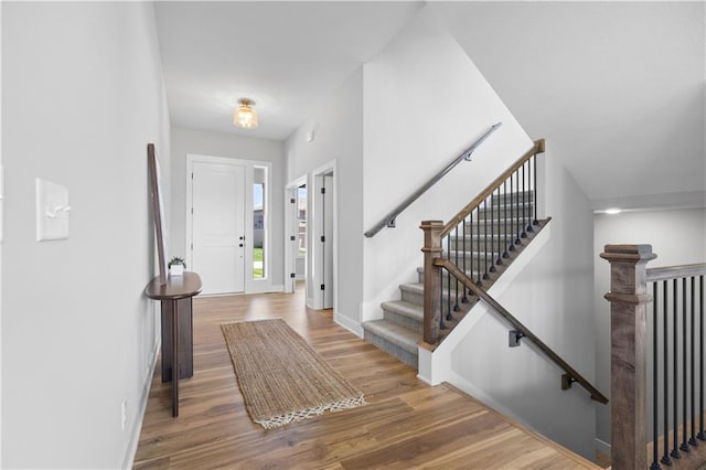1515 SW Arbor Park Dr, Lees Summit, MO 64082 - foyer entrance featuring wood finished floors and baseboards
