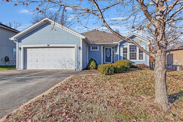 single story home featuring a garage