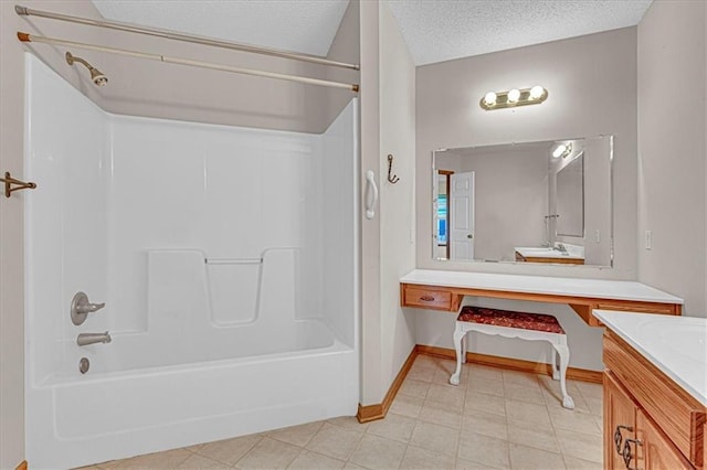 bathroom with bathtub / shower combination, a textured ceiling, and vanity