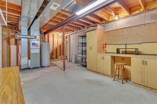 basement featuring heating unit, light colored carpet, and water heater