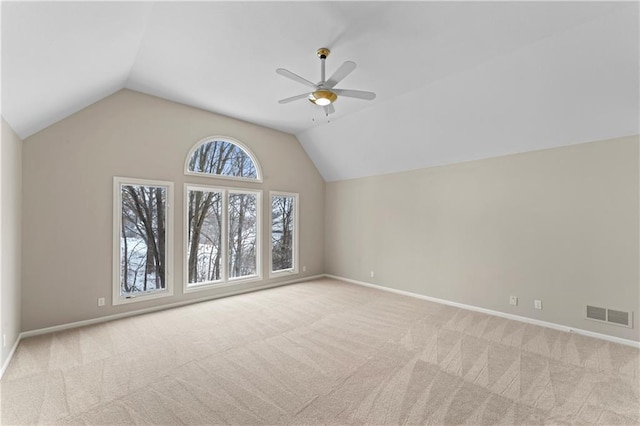 additional living space with light carpet, vaulted ceiling, and ceiling fan