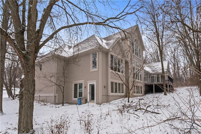 view of snow covered house