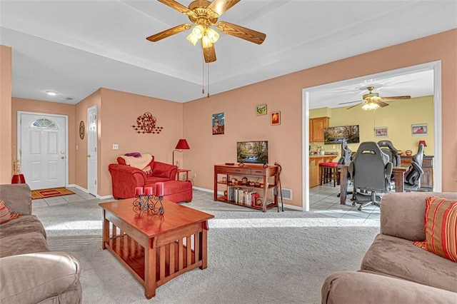 living room with ceiling fan and light carpet