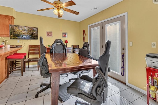 tiled home office with ceiling fan