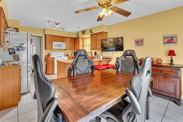 office space featuring ceiling fan and light tile patterned floors