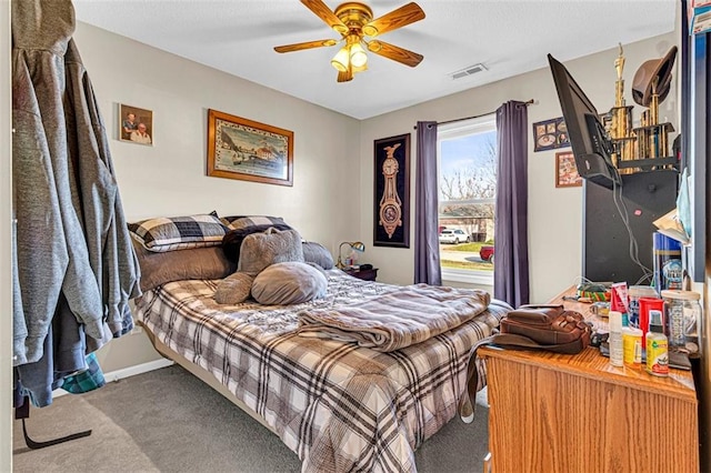 carpeted bedroom with ceiling fan