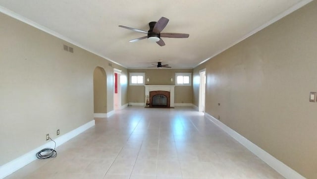 unfurnished living room featuring ceiling fan, crown molding, and light tile patterned flooring