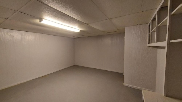 basement featuring a drop ceiling