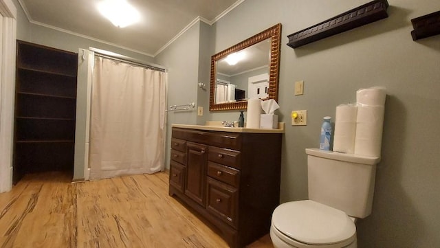 bathroom with vanity, a shower with shower curtain, toilet, ornamental molding, and wood-type flooring