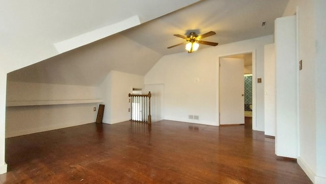 additional living space featuring ceiling fan, dark hardwood / wood-style flooring, and vaulted ceiling