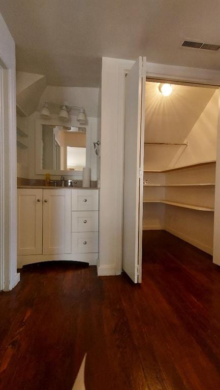 bathroom featuring vanity and wood-type flooring