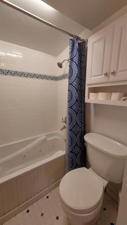 bathroom featuring shower / bath combination with curtain and toilet