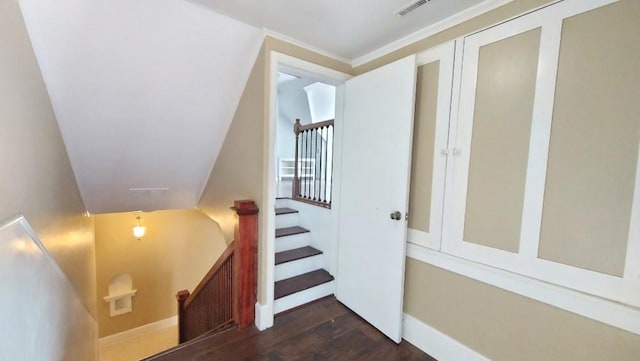 stairway with lofted ceiling and hardwood / wood-style flooring