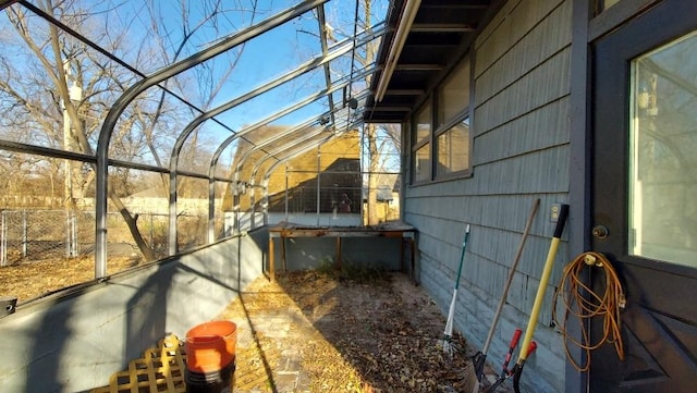 view of home's exterior with a sunroom