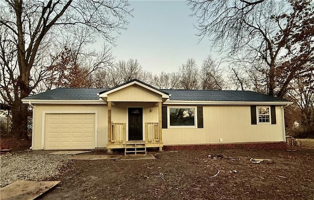 ranch-style home featuring a garage