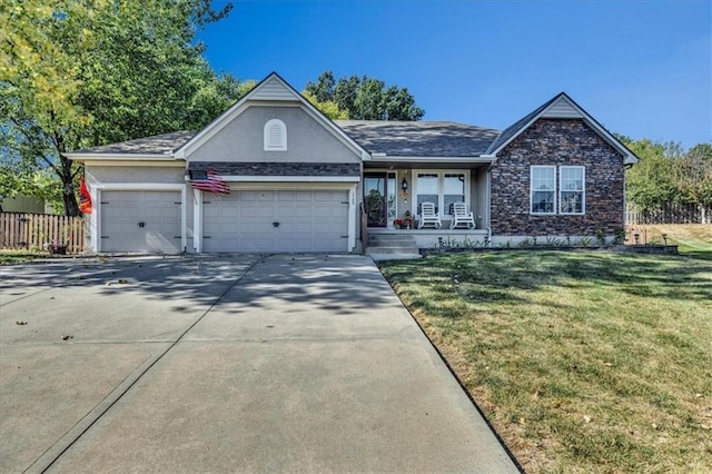 view of front of property with a garage and a front yard