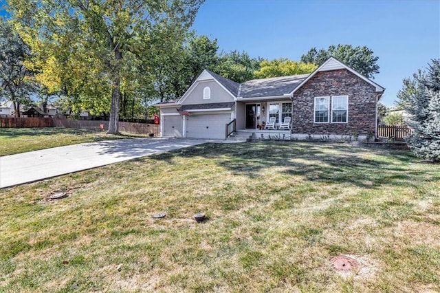 ranch-style home featuring a garage and a front yard