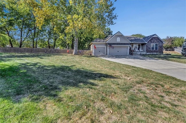 view of front of house with a garage and a front yard