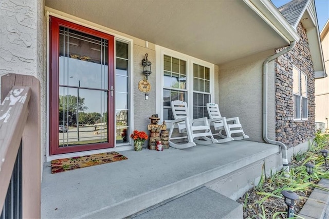 doorway to property featuring a porch