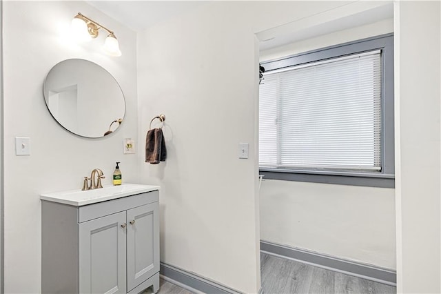 bathroom with hardwood / wood-style floors and vanity