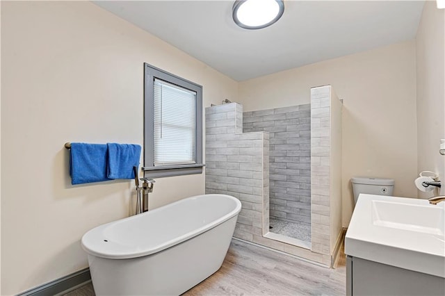 full bathroom featuring hardwood / wood-style floors, vanity, toilet, and plus walk in shower