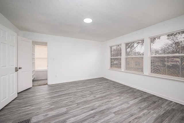 empty room featuring hardwood / wood-style floors