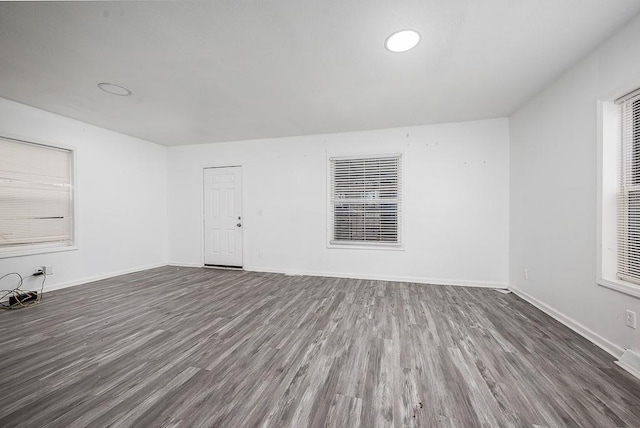 spare room featuring dark hardwood / wood-style flooring