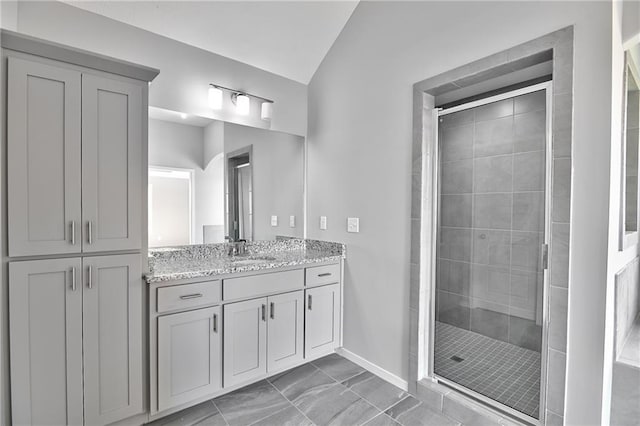 bathroom featuring vanity and an enclosed shower