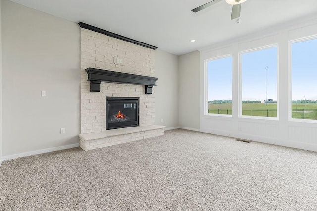17165 W 164th Ter, Olathe, KS 66062 - unfurnished living room featuring a ceiling fan, carpet flooring, a large fireplace, and recessed lighting