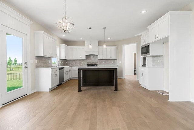 17165 W 164th Ter, Olathe, KS 66062 - kitchen featuring stainless steel appliances, decorative backsplash, light countertops, a chandelier, and recessed lighting