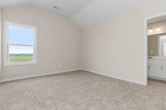17165 W 164th Ter, Olathe, KS 66062 - additional living space with lofted ceiling and light colored carpet