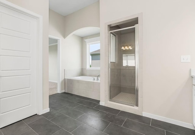 17165 W 164th Ter, Olathe, KS 66062 - bathroom featuring a bath, a stall shower, tile patterned floors, and vanity