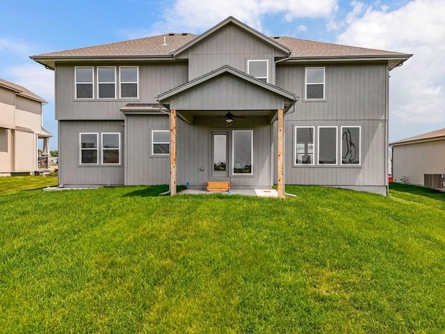 17165 W 164th Ter, Olathe, KS 66062 - back of property featuring ceiling fan, a yard, and a shingled roof