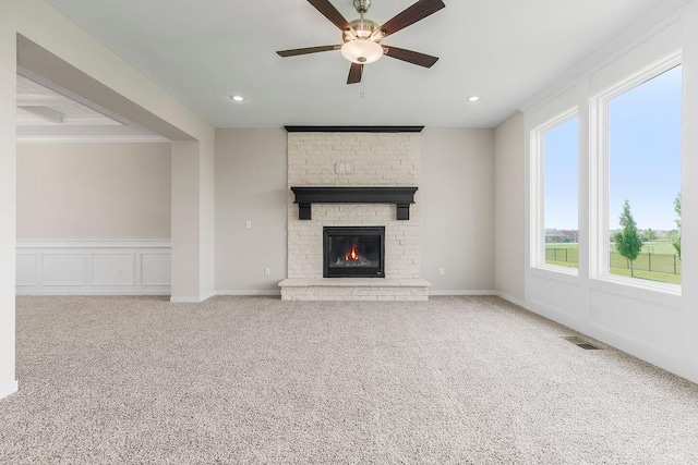 17165 W 164th Ter, Olathe, KS 66062 - unfurnished living room with a ceiling fan, carpet, a brick fireplace, crown molding, and recessed lighting