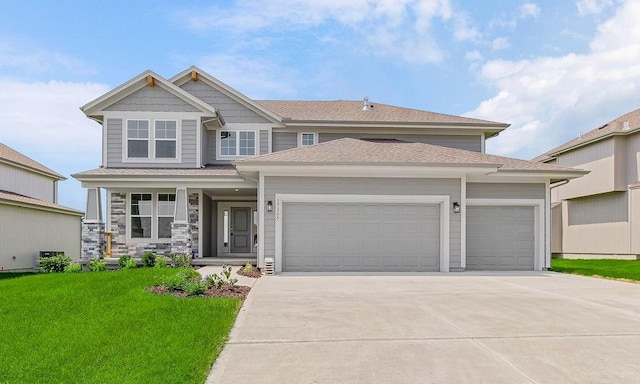 17165 W 164th Ter, Olathe, KS 66062 - view of front facade featuring an attached garage, driveway, a front lawn, covered porch, and roof with shingles