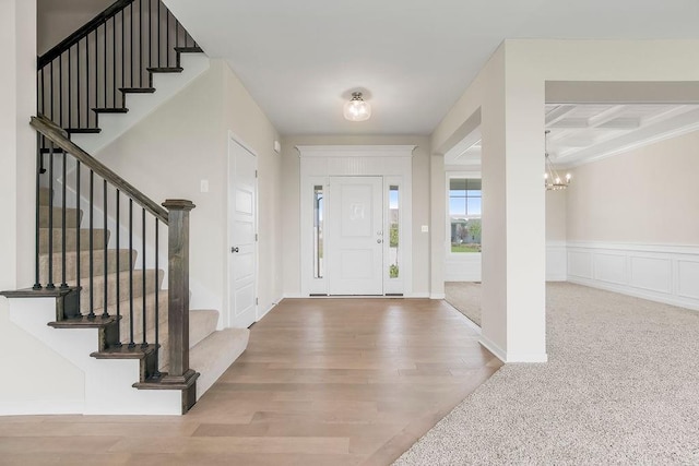 17165 W 164th Ter, Olathe, KS 66062 - entrance foyer featuring a chandelier, stairway, coffered ceiling, wood finished floors, and beam ceiling