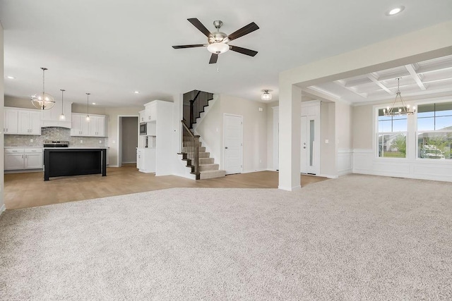 17165 W 164th Ter, Olathe, KS 66062 - unfurnished living room with a chandelier, coffered ceiling, light carpet, recessed lighting, and stairs