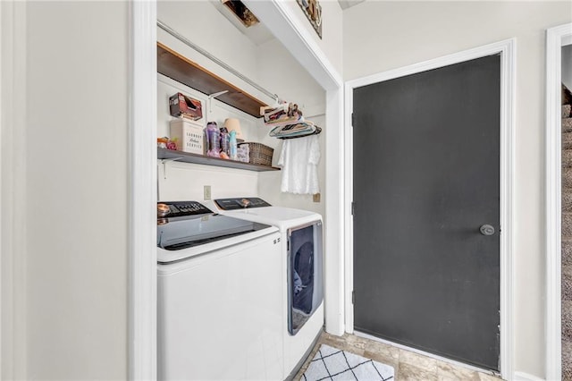 clothes washing area with washing machine and clothes dryer