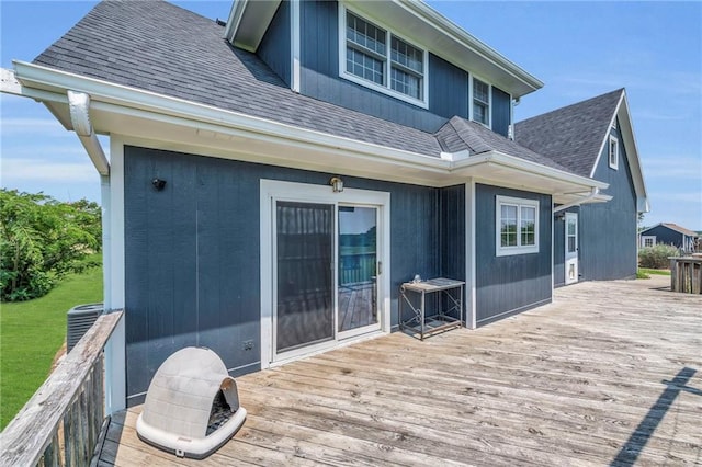 wooden terrace featuring central AC unit