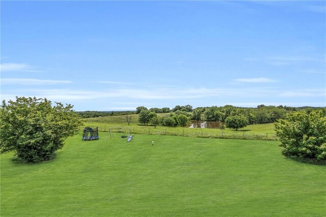 exterior space featuring a rural view and a trampoline