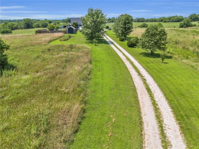 birds eye view of property featuring a rural view