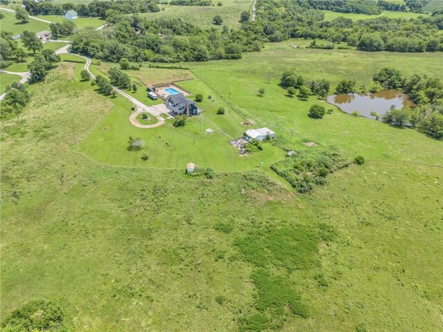 bird's eye view with a rural view and a water view