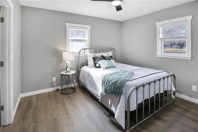 bedroom featuring ceiling fan and dark hardwood / wood-style flooring